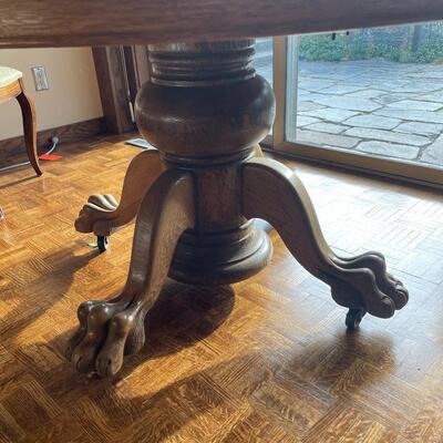 Beautiful round claw foot oak pedestal table