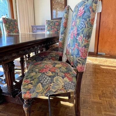 European dining table with carved base, two side chair and 8 dining chairs with nailhead trim
