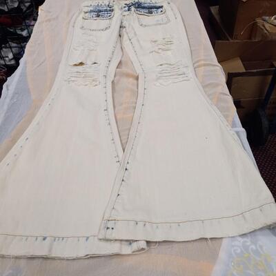 1 Pair of new Ripped low rise  New Jeans  Flare Legs Size  M