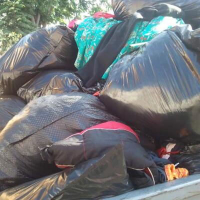 1 lot of  Freshly Donated Clothes and Shoes over 1000 Lbs (25 Garbage Bags)