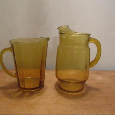 Two Amber Glass Tea/Water Pitchers