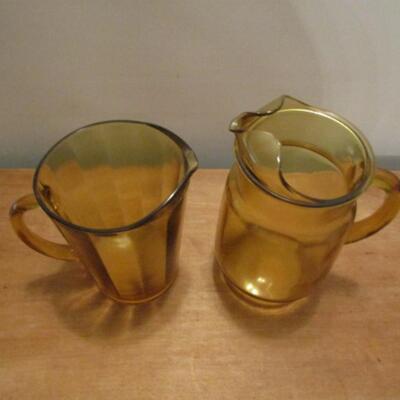 Two Amber Glass Tea/Water Pitchers