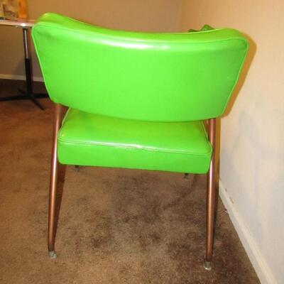 LOT 1  TWO MID-CENTURY MODERN VINYL ARM CHAIRS