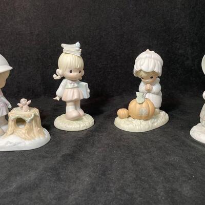 Lot 138  Four Precious Moments Figurines