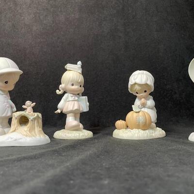 Lot 138  Four Precious Moments Figurines