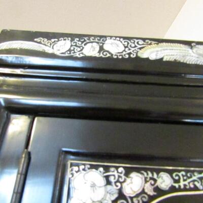 LOT 7  BLACK LACQUERED CABINET WITH ABALONE DESIGNS