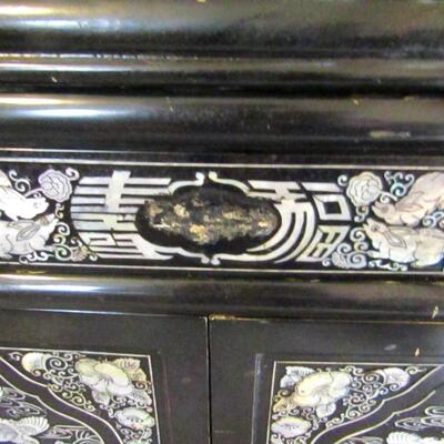 LOT 7  BLACK LACQUERED CABINET WITH ABALONE DESIGNS