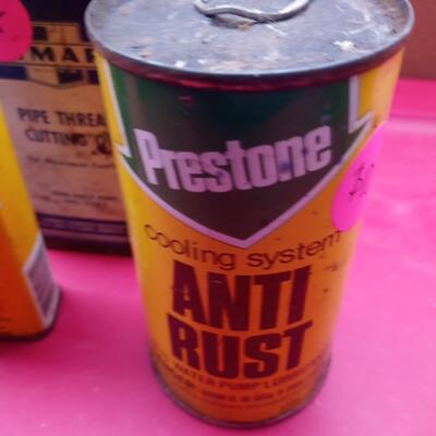 3 lubricant tins