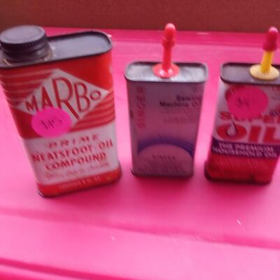 3 lubricant tins
