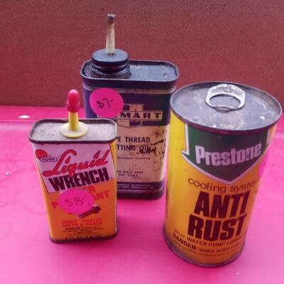 3 lubricant tins