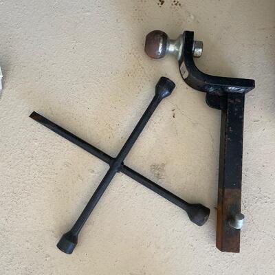 Lot 202  trailer hitch and tire iron