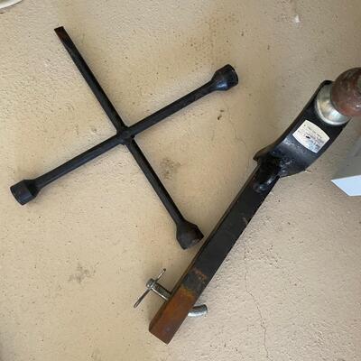Lot 202  trailer hitch and tire iron