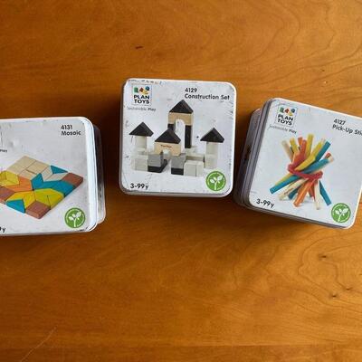Set of three (3) portable wooden toy games in tin boxes
