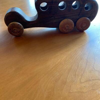 Wooden truck/bus toy with peg doll seats