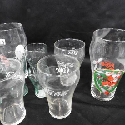 12 Coke Themed Glass, One Pencil, Some Santa Claus, Some Green Glass