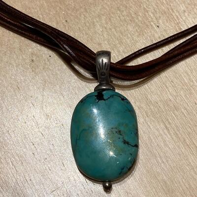 Leather strapped necklace with jade stone pendant