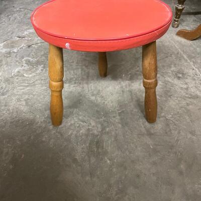 Round stool with red pad