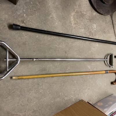 2 wooden canes 1 metal cane