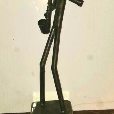 Tall mid-century brutalist steel sculpture of saxophone player