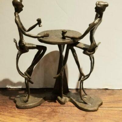 Expressive brutalist mid-century bronze sculpture depicting couple at table