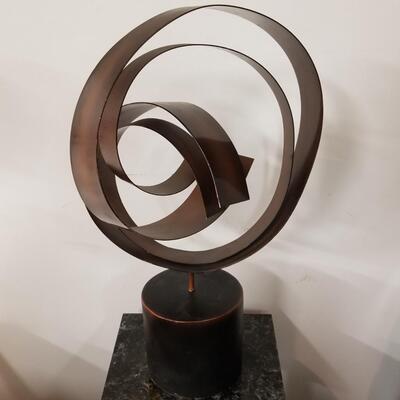 Striking mid-century ribbon sculpture signed by Curtis Jere... creating Art In Motion