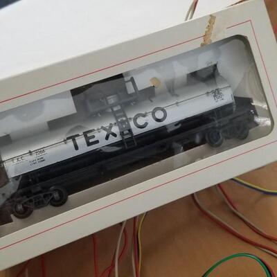 Lot #113  HO Scale Locomotive with 3 cars - track