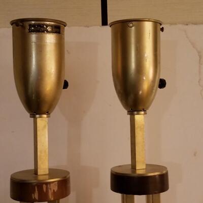 They are of mid-century modern tall metal lamps