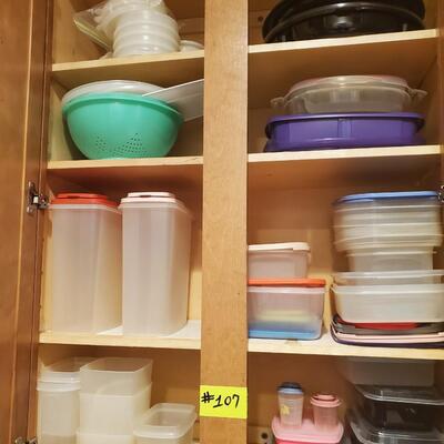 Cabinet full of Tupperware and plastic