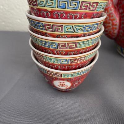 Chinese teapot, cups, bowls, spoons