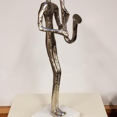 Mid-century brutalist metal sculpture of saxophone player