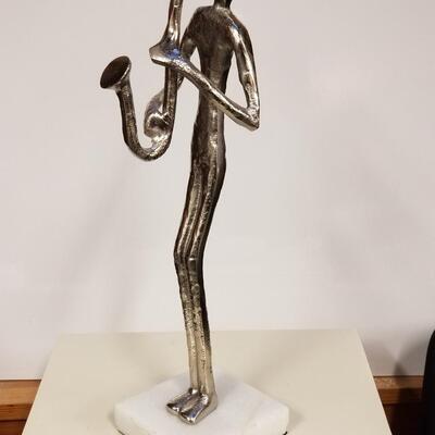 Mid-century brutalist metal sculpture of saxophone player