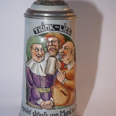 CHARACTER RELIEF GERMAN STEIN WITH PEWTERY LID AND INSET PROSIT