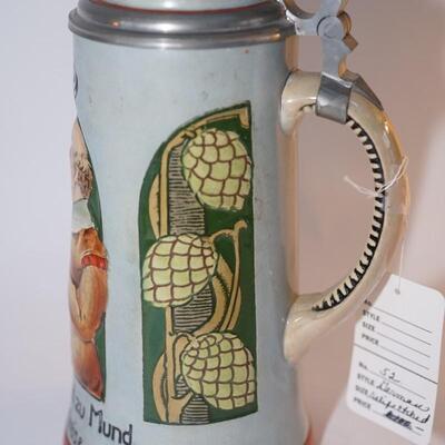 CHARACTER RELIEF GERMAN STEIN WITH PEWTERY LID AND INSET PROSIT