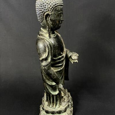 Beautiful Antique Standing Bronze Temple Buddha holding an offering