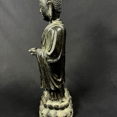 Beautiful Antique Standing Bronze Temple Buddha holding an offering
