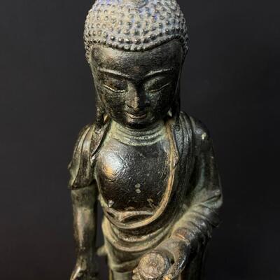 Beautiful Antique Standing Bronze Temple Buddha holding an offering