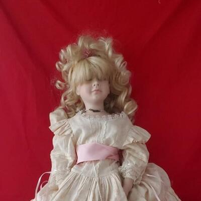 Doll in white and pink dress