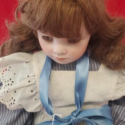 Doll in Blue and White Dress