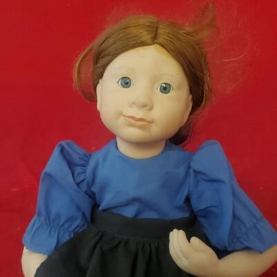 Doll in Blue and Black Dress