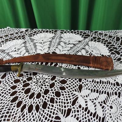Three unique long bladed swords /knives/bolos