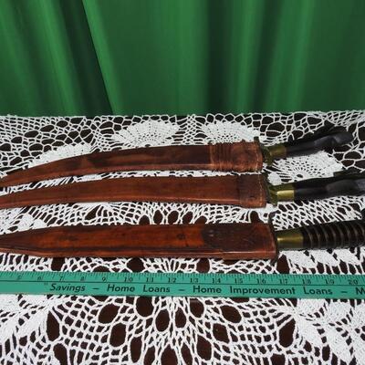 Three unique long bladed swords /knives/bolos