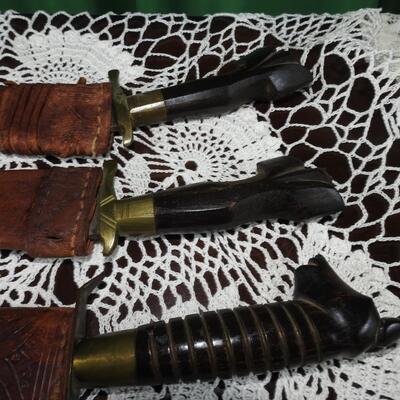 Three unique long bladed swords /knives/bolos