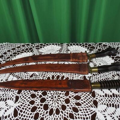 Three unique long bladed swords /knives/bolos