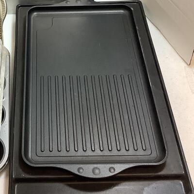 F537 Lot of Baking Sheets, Cast Iron Griddle, Muffins Pans in Various Sizes