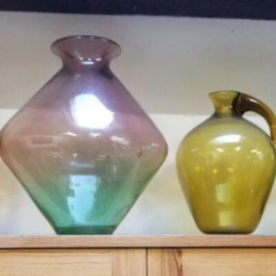 Group of four mid-century glass pieces with one green Blenko attributed vase