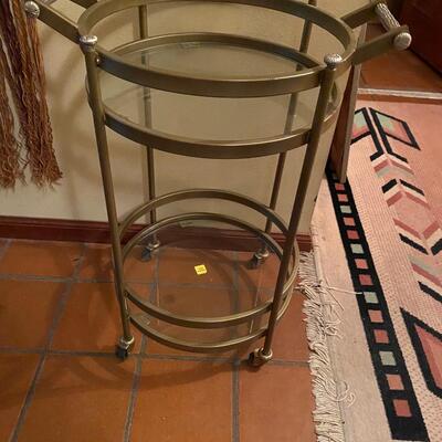 Two tiered glass & metal round cart on wheels - B