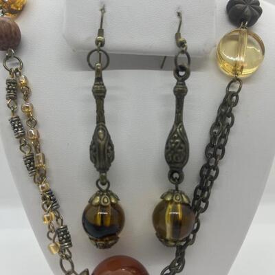 Lot 53: Earth-tone Beaded Necklace/ Earring Set & "Blingy" Beaded Multi Strand Necklace