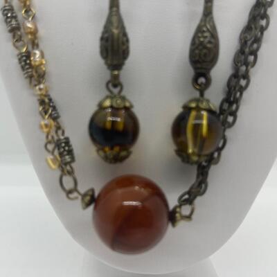 Lot 53: Earth-tone Beaded Necklace/ Earring Set & "Blingy" Beaded Multi Strand Necklace