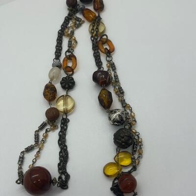 Lot 53: Earth-tone Beaded Necklace/ Earring Set & "Blingy" Beaded Multi Strand Necklace
