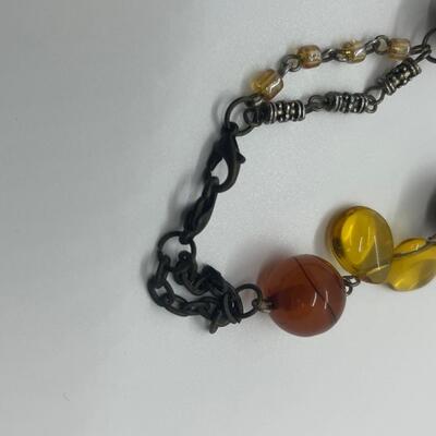 Lot 53: Earth-tone Beaded Necklace/ Earring Set & "Blingy" Beaded Multi Strand Necklace